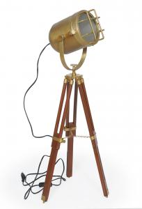 Brass projector lamp with grid and wooden tripod, decorative retro steampunk vintage